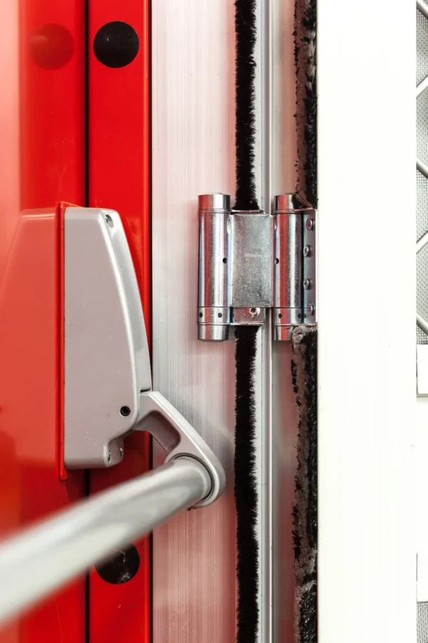 close up of a fly screen door hinge